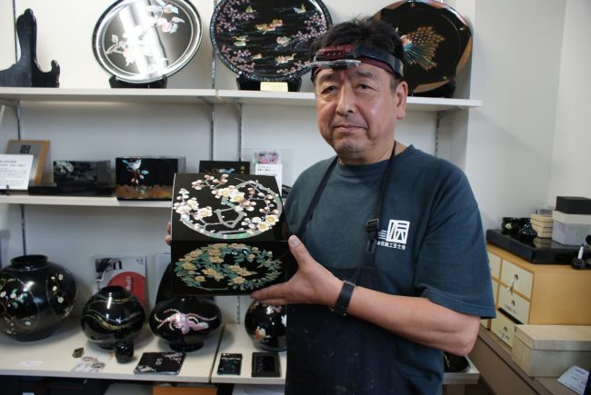 Rade, setting lustrous abalone shell into lacquerware