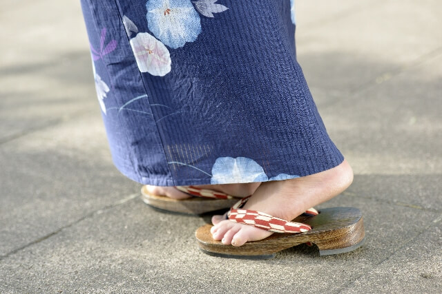 Five women in traditional Japanese kimono and footwear stock photo - OFFSET